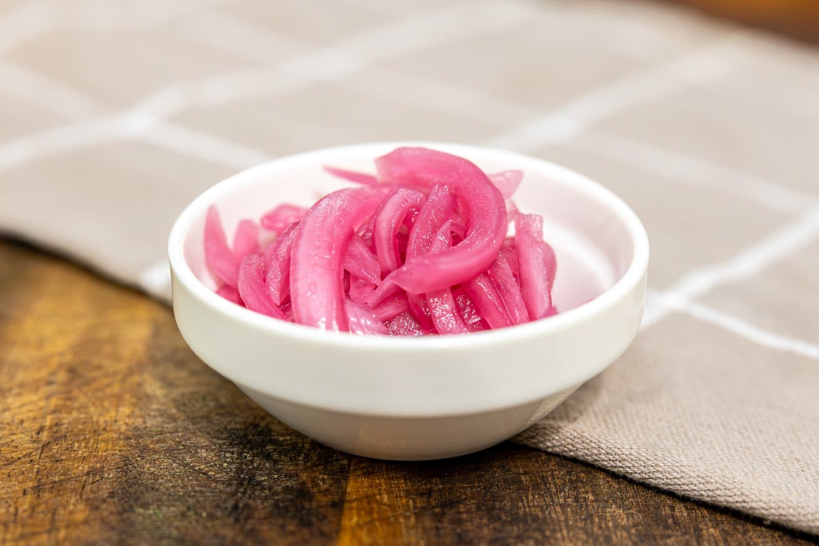 House-pickled red onions in a small bowl